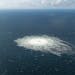 A large disturbance in the sea can be observed off the coast of the Danish island of Bornholm Tuesday, Sept. 27, 2022 following a series of unusual le
