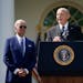 President Joe Biden listens as Bob Parant, Medicare beneficiary with Type 1 diabetes, speaks during an event on health care costs in the Rose Garden o