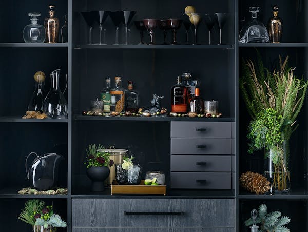 Build a festive holiday bar with doors, drawers and shelves made to fit your space. Fill with vintage or new glassware, liquor and greenery to ring in