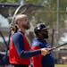 Twins manager Rocco Baldelli, left, and third base coach Tommy Watkins watched players stretch during spring training at Hammond Stadium in Fort Myers