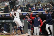 Minnesota Twins designated hitter Billy Hamilton (0) scores on a single by Minnesota Twins second baseman Luis Arraez (2) in the eighth inning.