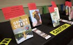 A selection of banned and challenged books are seen on a table as members of City Lit Theater Company read excerpts from them during Banned Books Week