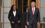 Supreme Court Associate Justice Ketanji Brown Jackson and Chief Justice of the United States John Roberts arrive to stand outside the Supreme Court fo