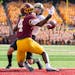 Minnesota Gophers defensive back Terell Smith (4) was called for pass interference as he broke up a pass to Purdue Boilermakers wide receiver Charlie 