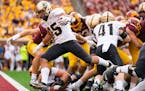 Purdue running back Devin Mockobee followed his long fourth-quarter run with a 2-yard touchdown run that all but put away the victory over the Gophers