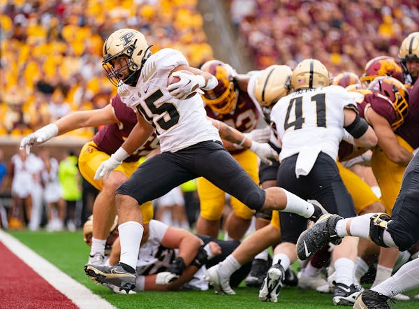 Purdue running back Devin Mockobee followed his long fourth-quarter run with a 2-yard touchdown run that all but put away the victory over the Gophers