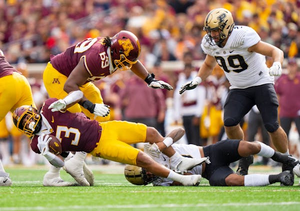 Gophers running back Trey Potts was tackled by Purdue cornerback Bryce Hampton in the first quarter Saturday.