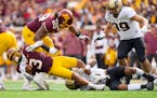 Minnesota Gophers running back Trey Potts (3) is tackled by Purdue Boilermakers cornerback Bryce Hampton (0) in the first quarter Saturday, Oct. 1, 20