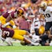 Minnesota Gophers running back Trey Potts (3) is tackled by Purdue Boilermakers cornerback Bryce Hampton (0) in the first quarter Saturday, Oct. 1, 20