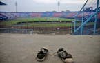 A pair of sneakers sit trampled in the stands of Kanjuruhan Stadium following a deadly soccer match stampede, in Malang, East Java, Indonesia, Sunday,