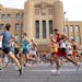 Runners made their way past the Armory in downtown Minneapolis during the Twin Cities Marathon on Sunday.