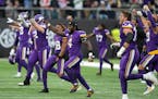 Minnesota Vikings players celebrate after beating the Saints.