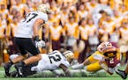 Tanner Morgan was sacked twice against Purdue on Saturday in a game where the Gophers quarterback threw three interceptions.