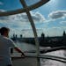 A visitor rides on the London Eye in London, Wednesday Sept. 14, 2022.