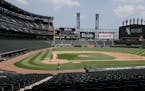 The Chicago White Sox take part in baseball practice at Guaranteed Rate Field in Chicago, Thursday, July 9, 2020. (AP Photo/Nam Y. Huh)