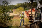 A construction crew worked Monday on the new Battle Creek Winter Recreation area at Battle Creek Regional Park in St. Paul.