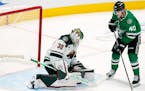 Jesper Wallstedt blocked a shot by Stars forward Jacob Peterson during a preseason game Thursday in Dallas.