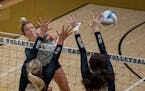 Carly Gilk hammered a spike for Champlin Park, ranked first in Class 4A by the Minnesota Volleyball Coaches Association. 