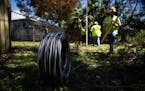 Workers for Florida Power and Electric repair a power line damaged by Hurricane Ian in Naples, Fla., on Monday, Oct. 3, 2022. The utility said Monday 