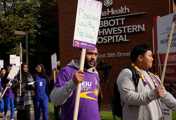 Striking Allina Health mental health workers picketed in front of Abbott Northwestern Hospital in Minneapolis on Monday.