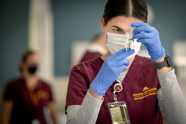 First-year nursing student Mallory Willett practices drawing insulin during a class at the University of Minnesota in Minneapolis on Monday. The Unive