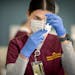 First-year nursing student Mallory Willett practices drawing insulin during a class at the University of Minnesota in Minneapolis on Monday. The Unive