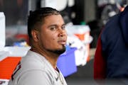Luis Arraez looked out from the Twins dugout after leaving Wednesday’s game in Chicago.