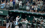 The Yankees’ Aaron Judge was greeted at the dugout by teammates and cheering fans after hitting his 62nd home run of the season Tuesday against the 