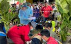 First responders attend to a victim at the site of an attack at a day care center, Thursday, Oct. 6, 2022, in the town of Nongbua Lamphu, north easter