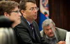 Then-Hennepin County commission chairperson Mike Opat, center, speaks about a state shutdown on June 23, 2011.