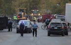 Minneapolis Police taped off several blocks surrounding the Near North homeless encampment Thursday, October 6, 2022 as an estimated 30 people were ev