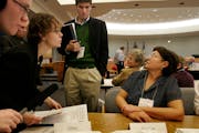 As the Minnesota U.S. Senate race recount begins on Nov. 19, 2008 , election manager Rachel Smith, third from left, receives the day’s first recount