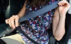 A driver buckles up. A lack of seat belt use is one of the four leading causes of traffic fatalities in Minnesota, Department of Public Safety data sh