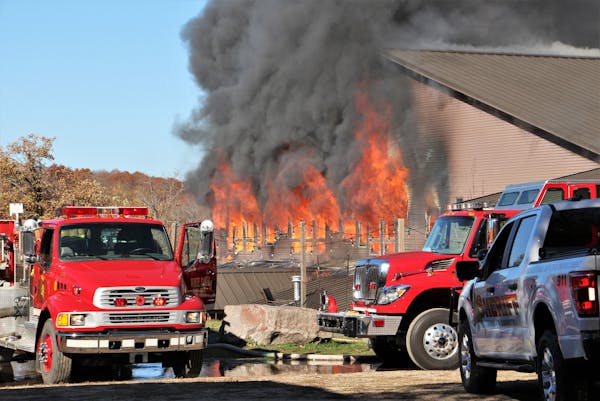 Firefighters worked to extinguish a blaze at the main lodge of Maplelag Resort near Callaway, Minn., on Oct. 10, 2022.