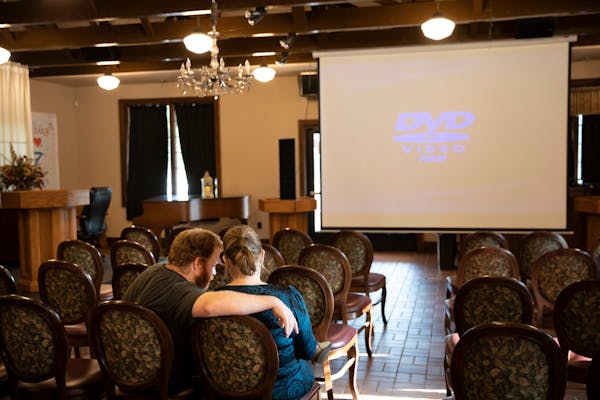 A couple waited for a short film showing at the Zephyr Theatre, formerly the Zephyr Tain Depot, in Stillwater in August 2018.