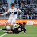 Minnesota United defender D.J. Taylor knocked Vancouver Whitecaps forward Brian White (24) off the ball on Oct. 9 at Allianz Field.