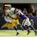 Green Bay Packers quarterback Aaron Rodgers (12) left the game after a hit on this play by Minnesota Vikings outside linebacker Anthony Barr.