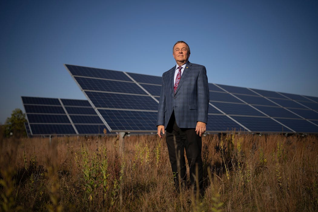 Greg Ridderbusch, CEO of Connexus Energy, at a solar array next to the utility’s headquarters in Ramsey. The utility now has 120 acres of solar arrays with pollinator meadows underneath.