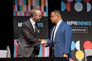 Republican challenger Jim Schultz and Democratic Attorney General Keith Ellison shook hands before a debate Friday in St. Paul.