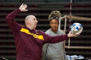 Gophers volleyball coach Hugh McCutcheon, shown here working with freshman Carter Booth earlier this year, announced he will leave the program at the 