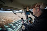 Deron Johnson adjusted his radio as he listened to and watched the Gophers football game Saturday on his farm in Hector.