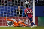FC Dallas forward Alan Velasco scored against Minnesota United goalkeeper Dayne St. Clair on a penalty kick in Frisco, Texas, After being tied 1-1, FC