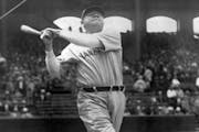 In this June 18, 1929, photo, New York Yankees’ Babe Ruth took a big swing at Yankee Stadium.