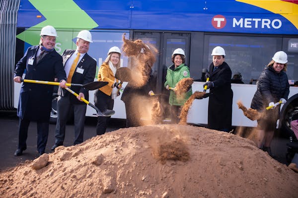 Sen. Amy Klobuchar, D-Minn., in green, was among the officials on hand for the ceremonial groundbreaking on the Gold Line on Wednesday in Woodbury.