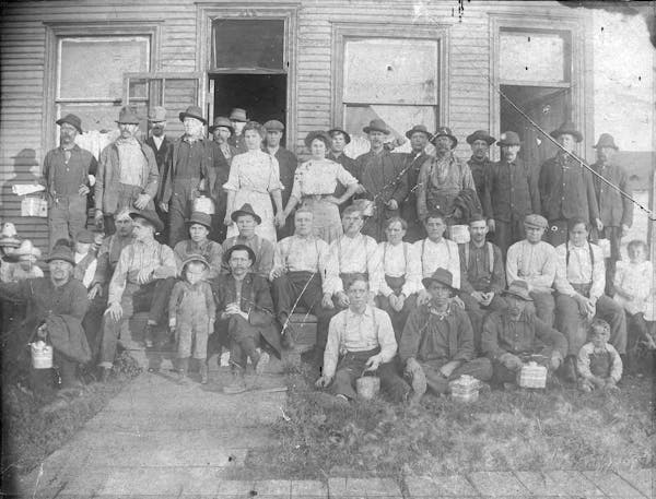Boarders posed in front of the Elanto Boarding House, a Finnish business, on the Mesabi Range in the early 1900s. 