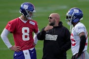 The Giants are among the season’s biggest surprises behind new coach Brian Daboll, center, with quarterback Daniel Jones, left, and running back Saq