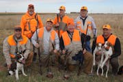 Gov. Tim Walz, shown kneeling second from right on the opener Oct. 15, bagged two birds.