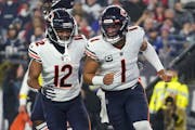 Chicago Bears quarterback Justin Fields (1) celebrates after his touchdown against the New England Patriots during the first half of an NFL football g