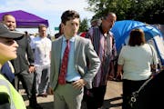 Minneapolis Mayor Jacob Frey visited a homeless encampment near the LIttle Earth housing project in 2018. Protesters who are angry about what they cal
