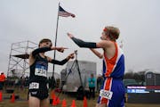 Aidan Jones, right, of Minneapolis Washburn won the boys 3A with a time of 15:11.73, Sam Scott, left, of Minneapolis Southwest finished second with a 